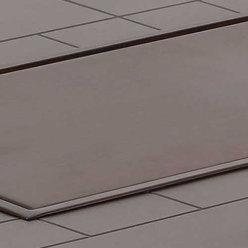 Close-up of a brown tile with a grid pattern
